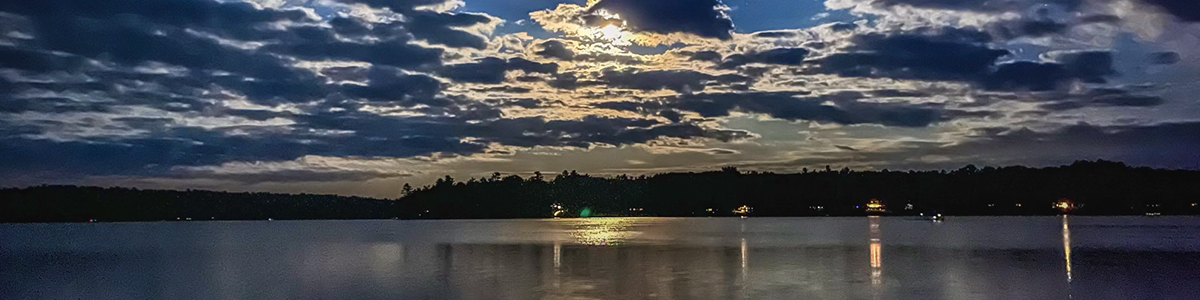 Canoes at the shoreline on Annabessacook Lake